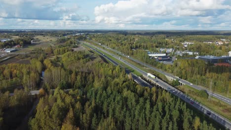 Aerial-follows-automobile-traffic-driving-on-highway-in-Kerava-Finland