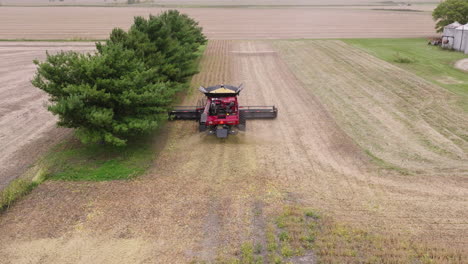 Aerial-of-Combine-Harvester-Collecting-Crop-Grains-on-a-Farm-Field