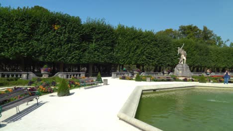 Panoramic-View-of-Beautiful-Gardens-and-Statues-of-Mirabell-Palace-with-Fountain-in-the-Middle-on-Sunny-Day