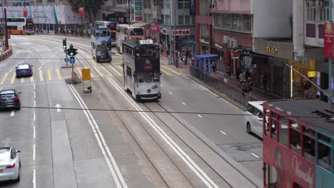 Double-decker-trams-and-buses-on-the-busy-street-of-Kings-Road