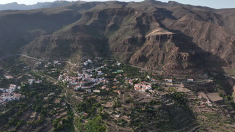 Orbital-aerial-view-of-the-city-of-Temisas-and-the-Audiencia-caves-in-the-municipality-of-Aguimes,-Gran-Canaria