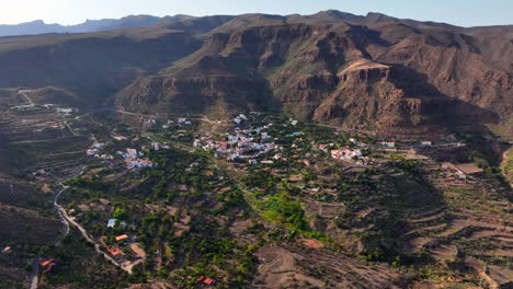 Fantastic-aerial-view-in-orbit-over-the-city-of-Temisas-and-the-Cuevas-de-la-Audiencia-in-the-municipality-of-Aguimes,-Gran-Canaria,-on-a-sunny-day