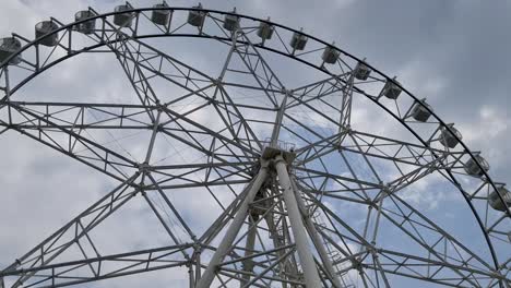 Low-angle-shot-of-a-slow-moving-Ferris-wheel