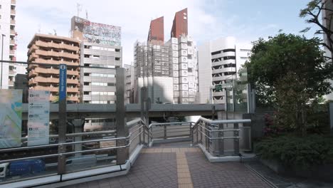 The-Nakagin-Capsule-Tower-Building-being-demolished-low-angle-view-from-a-nearby-walkway