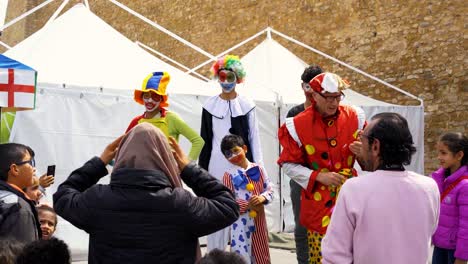 a-clown-does-his-show-in-front-of-children-in-the-medina-in-hammamet-tunisia