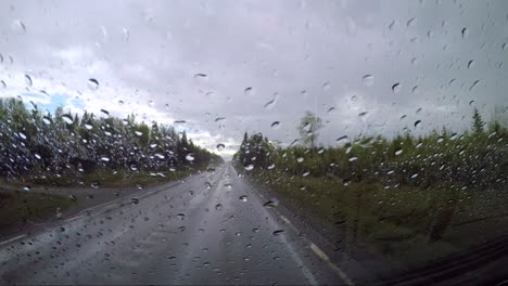 View-from-the-car-in-the-rain-driving-on-wet-roads.-Driving-a-Car-on-a-Road-in-Norway