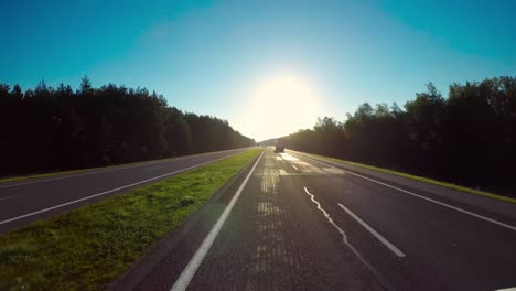Timelapse-car-driving-on-the-autobahn-at-sunrise