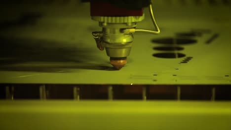 CNC-Laser-cutting-of-metal-in-slow-motion,-modern-industrial-technology.