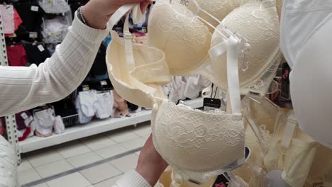 Woman-shopping-in-mall.-Choosing-underwear,-bra.