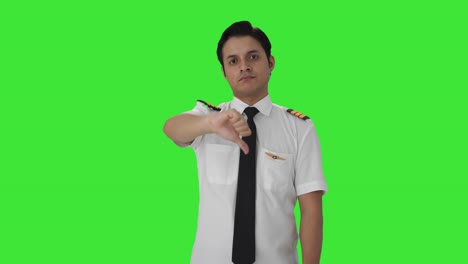 Disappointed-Indian-pilot-showing-thumbs-down-Green-screen