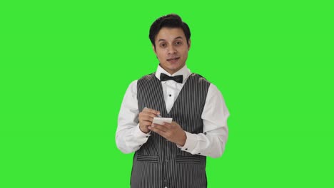 Happy-Indian-waiter-taking-order-Green-screen