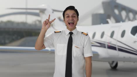 Happy-Indian-pilot-showing-victory-sign
