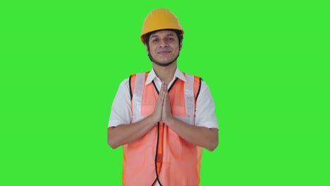 Happy-Indian-architect-doing-Namaste-Green-screen