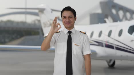 Happy-Indian-pilot-showing-okay-sign