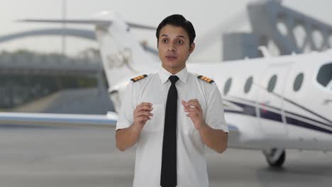 Serious-Indian-male-pilot-talking
