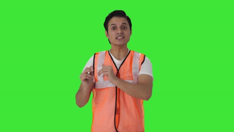 Happy-Indian-airport-ground-staff-worker-talking-Green-screen
