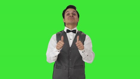 Happy-Indian-waiter-showing-thumbs-up-Green-screen