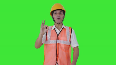 Happy-Indian-architect-showing-okay-sign-Green-screen