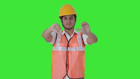 Disappointed-Indian-architect-showing-thumbs-down-Green-screen