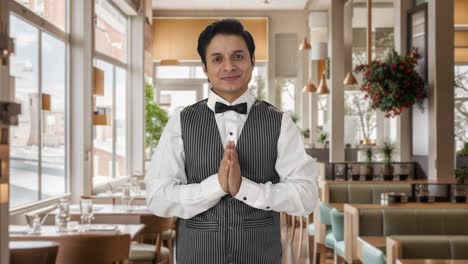 Happy-Indian-waiter-doing-Namaste