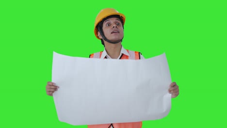 Happy-Indian-architect-explaining-the-map-to-client-Green-screen