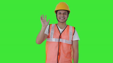 Happy-Indian-construction-labour-waving-Hello-Green-screen