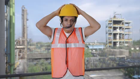Happy-Indian-construction-worker-wearing-the-helmet