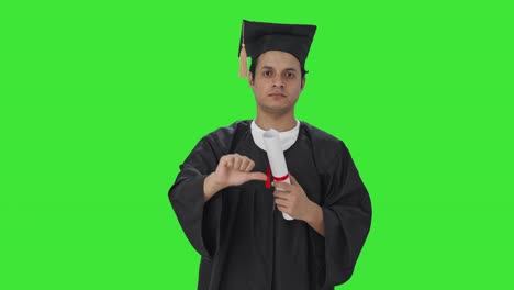 Disappointed-Indian-college-student-showing-thumbs-down-Green-screen