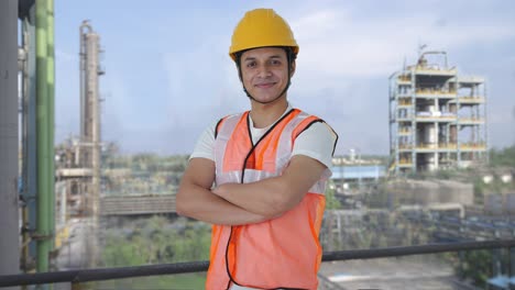 Portrait-of-Happy-Indian-construction-worker-standing-crossed-hands