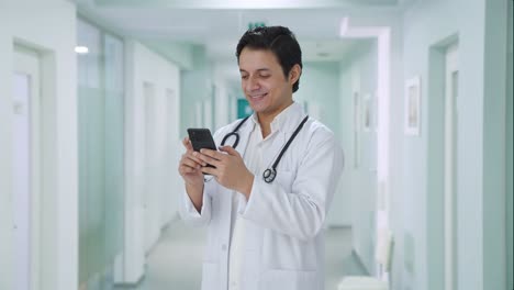 Happy-Indian-doctor-chatting-on-phone