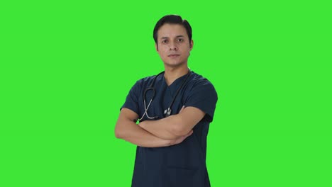 Portrait-of-confident-Indian-doctor-standing-crossed-hands-Green-screen
