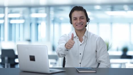 Happy-Indian-call-center-employee-showing-thumbs-up