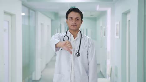 Disappointed-Indian-doctor-showing-thumbs-down