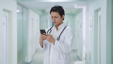 Angry-Indian-doctor-chatting-on-phone
