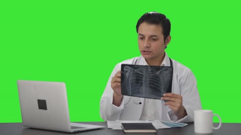 Indian-doctor-checking-the-X-ray-report-Green-screen