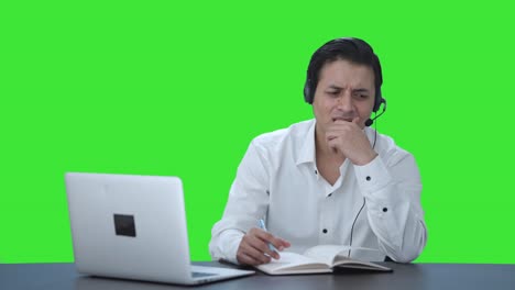 Confused-Indian-call-center-employee-trying-to-understand-customer-Green-screen