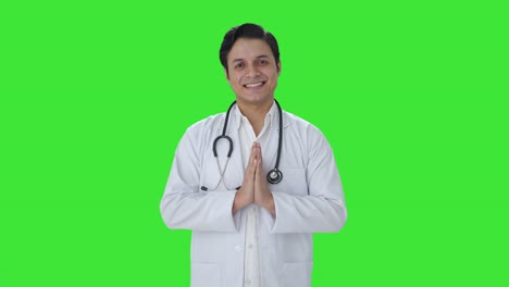 Happy-Indian-doctor-doing-Namaste-and-greetings-Green-screen