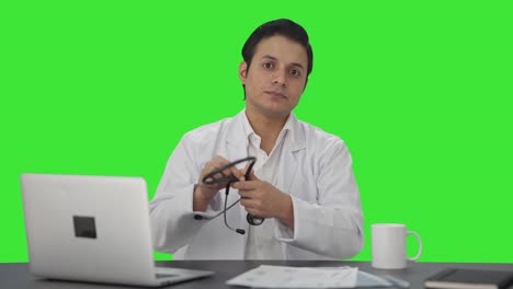 Sad-Indian-doctor-explaining-to-patient-Green-screen