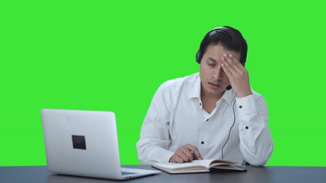 Stressed-Indian-call-center-employee-trying-to-understand-customer-Green-screen