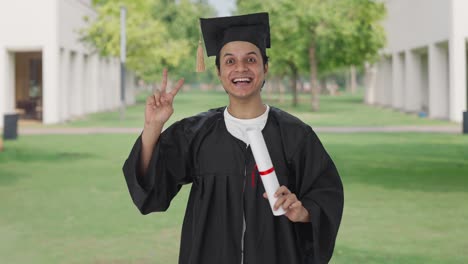 Happy-Indian-college-student-showing-victory-sign