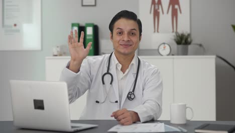 Happy-Indian-doctor-waving-Hi-to-the-camera
