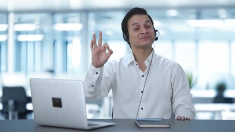Happy-Indian-call-center-employee-showing-okay-sign