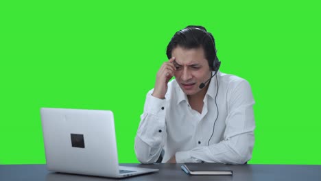 Confused-Indian-call-center-employee-talking-to-customer-Green-screen