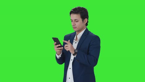 Indian-manager-using-mobile-phone-Green-screen