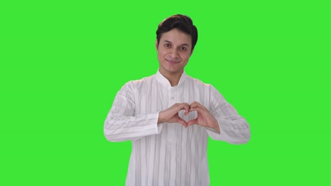 Happy-Indian-man-showing-heart-sign-Green-screen