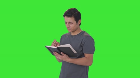 Verwirrter-Indischer-Mann,-Der-Ein-Buch-Liest,-Grüner-Bildschirm