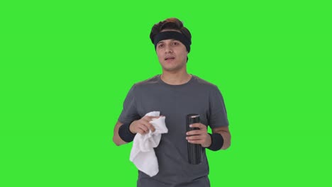 Indian-man-wiping-sweat-and-drinking-water-after-exercise-Green-screen