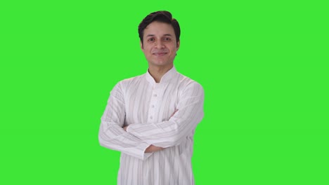 Happy-Indian-man-standing-crossed-hands-side-angle-Green-screen