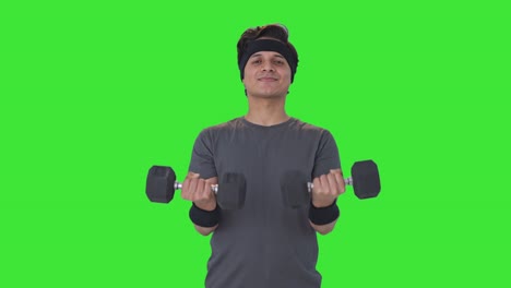 Happy-Indian-man-lifting-heavy-dumbells-and-doing-exercise-Green-screen