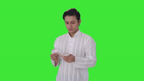 Indian-man-loses-money-while-counting-Green-screen